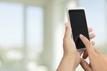 Human holding a modern phone with a blank screen