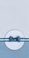 gift card, blue gift box and white ribbon bow, isolated on blue and gray fabric background, top...