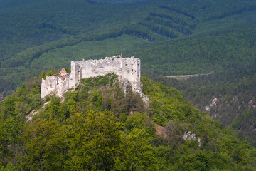Fototapeta na wymiar Ruins of medieval castle Uhrovec. Slovakia. Tourist attraction, tourism destination. Slovak historical castles, chateaus and churches.