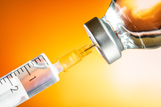 Close Up Shot Of A Pile Of Medical Insulin Needles With Orange