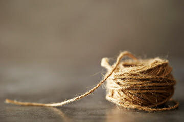 a bundle of yarn on a gray background