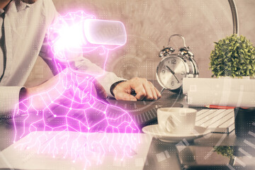 Double exposure of man's hands holding and using a digital device and AR glasses drawing. Virtual reality concept.