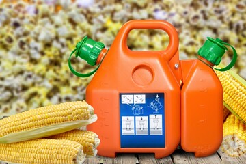 Ethanol gasoline fuel nozzle and corn kernels. Biofuel, agriculture and price concept