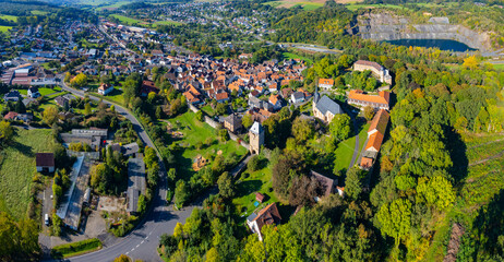 Aerial around the city Ortenberg in Germany, hesse on a sunny morning in summer. - obrazy, fototapety, plakaty