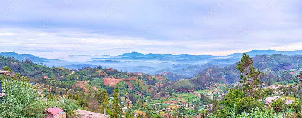 Wall mural Panorama of the foggy mountain landscape of Nuwara Eliya suburb