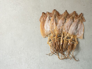 pile of dried squid on marble background