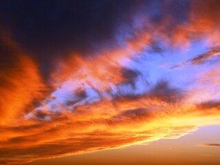 beautiful evening sky in bright colors of torn clouds, beauty in the nature of sunset heavenly space, twilight high sky at golden hour, natural landscape of stormy cloudy skies