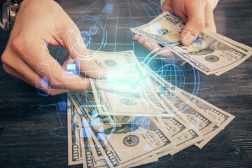 Multi exposure of social network theme drawing hologram and USA dollars bills and man hands.