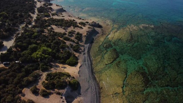 Aerial drone view of the rocky coast and the Mediterranean Sea near the scenic Aphrodite Trail in the Akamas Peninsula National Park, Cyprus. Famous tourist travel destination near Polis city,