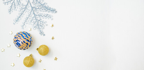 Flat lay frame with christmas balls on a white background. Christmas and New Year banner with copy space for your text