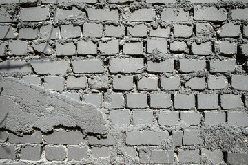 .Old grungy  grey brick wall background.