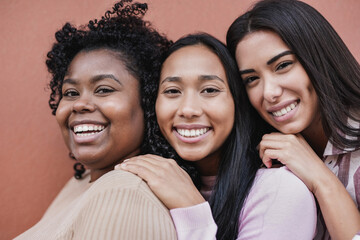 Beautiful multiracial girls smiling on camera - Young latin women with different skin colors and...