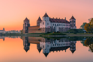 Mir Castle and its reflection against the purple sunset sky, Belarus.