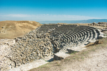 Ancient theater on the mountainside. Ancient theater structure thousands of years old.