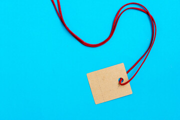 Black Friday. Brown label with a cord on a blue background and copy space.