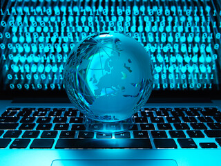Globe illustrating the world on a laptop computer with screen been infected by a cyber attack
