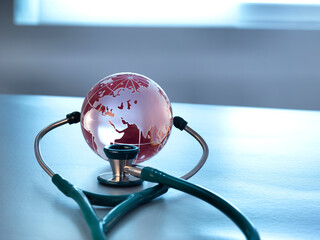 Global Healthcare, a glass globe and a stethoscope
