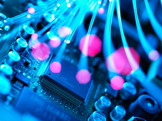 Fibre optics carrying data passing across electronic circuit board