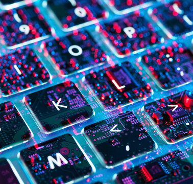 Double exposure of a laptop computer showing electronic components under the keyboard