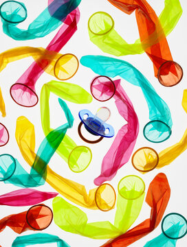 Birth control, Condoms encircling a babies soother