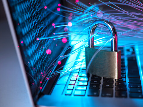 Padlock protecting laptop from computer virus represented by optical fibers