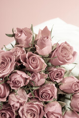 A bouquet of pink roses on a delicate white-pink background. macro. view from above