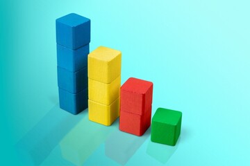 Geometric shapes in vertical composition on blue background. Creative gravity concept.