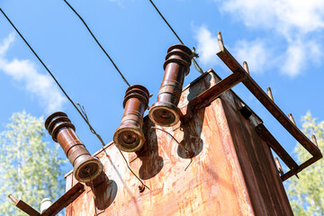 Old voltage power transformer substation at the countryside
