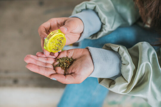 Woman preparing Marihuana joint, close-up