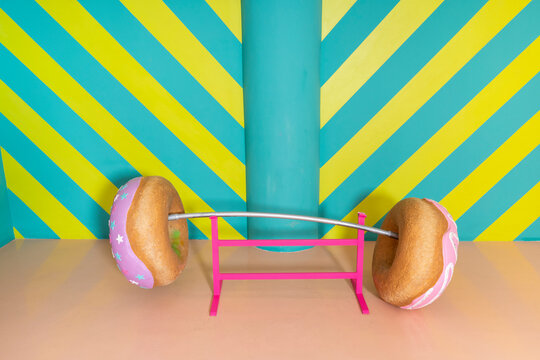 Oversized donuts as barbell at an indoor theme park