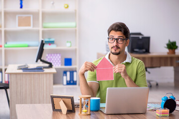 Young male designer working in the office