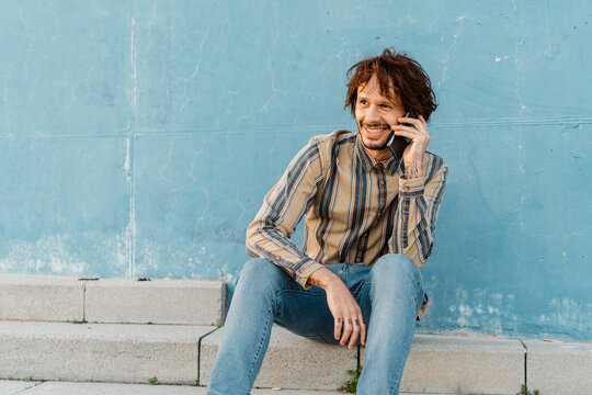 Portrait of bearded man on the phone in the evening