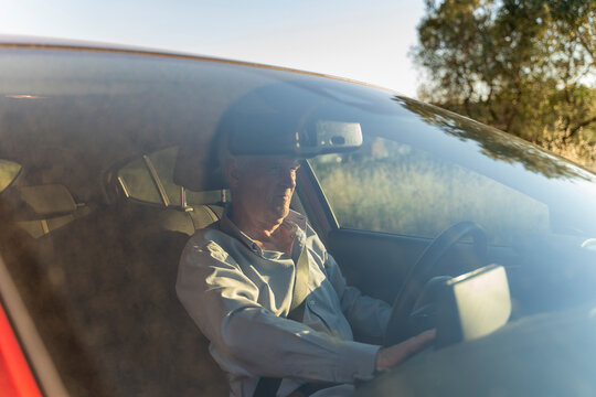 Senior man driving a car