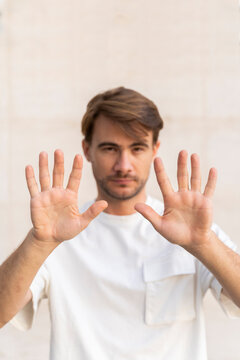 Man raising hands, close-up