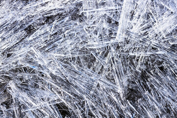 a backdrop made of ice needle-like shards of ice