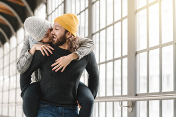 Happy young couple having fun at a subway station, Berlin, Germany