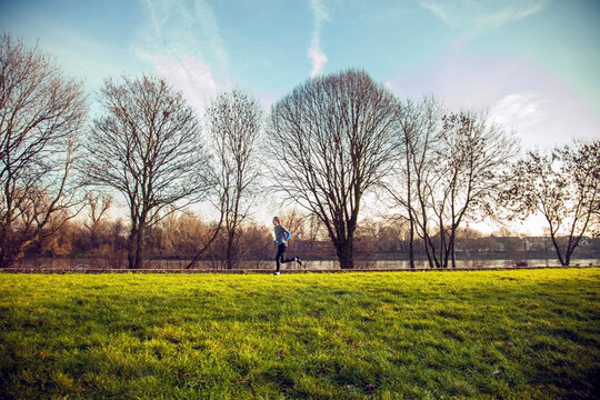 Young man jogging in a park