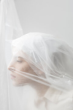 Graceful woman trapped in a veil