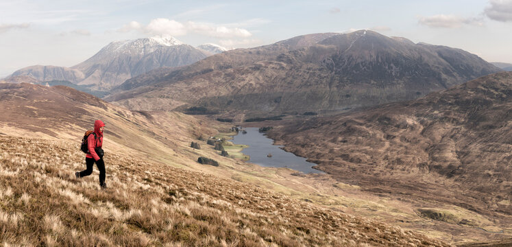 UK, Scotland, Onich, Beinn Na Gucaig, woman hiking in mountain scenery