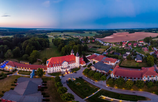 Germany, Mecklenburg-Western Pomerania, Mecklenburg Lake District, Goehren-Lebbin, Aerial view of Castle Hotel Fleesensee in the evening