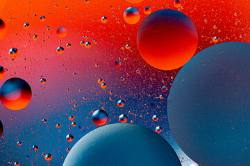 Abstract colorful background of oil circles. Oil in the water surface circles, water foam and oil bubbles.