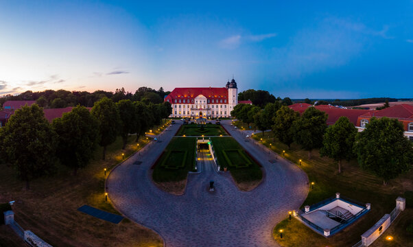 Germany, Mecklenburg-Western Pomerania, Mecklenburg Lake District, Goehren-Lebbin, Aerial view of Castle Hotel Fleesensee in the evening