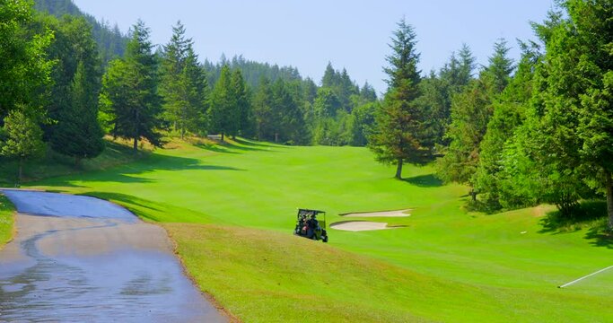 Establishing shot of golf course with gorgeous green and fantastic forest view in Vancouver, Canada, North America. Day time on May 2021. Still camera. ProRes 422 HQ.