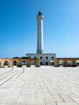 Italy, Province of Lecce, Santa Maria di Leuca, High white lighthouse standing against clear sky
