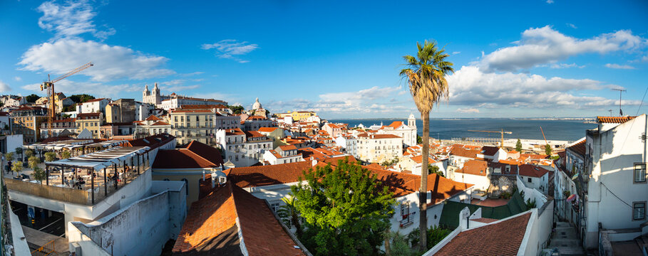 Portugal, Lisbon, Alfama, View from Miradouro de Santa Luzia over district with Sao Vicente de Fora Monastery, River Tagus, panoramic view