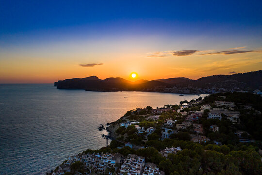 Spain, Mallorca, Santa Ponsa, Aerial view of coastal town at sunset
