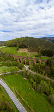 Germany, Hesse, Erbach, Aerial view of country road in front of Himbachel Viaduct