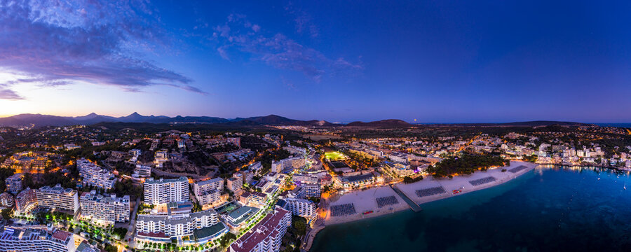 Spain, Balearic Islands, Mallorca, Calvia region, Aerial view over Costa de la Calma and Santa Ponca with hotels and beaches at sunset