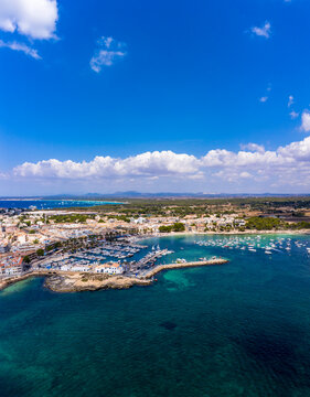 Spain, Balearic Islands, Colonia de Sant Jordi, Aerial view of blue summer sky over harbor of coastal town