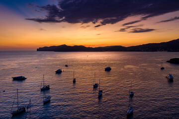 Spain, Mallorca, Santa Ponsa, Aerial view of boats floating in coastal water at dusk